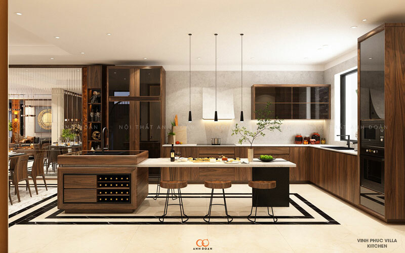 Ngoài việc tạo thêm không gian cho phòng bếp, một trong số những công dụng hàng đầu của bàn đảo chính là để trang hoàng cho không gian nhà bếp vốn thường được bài trí đơn giản. Bộ bàn đảo gỗ óc chó tinh tế đặt ở giữa nhà bếp khiến căn bếp thêm phần thanh lịch và hiện đại.
